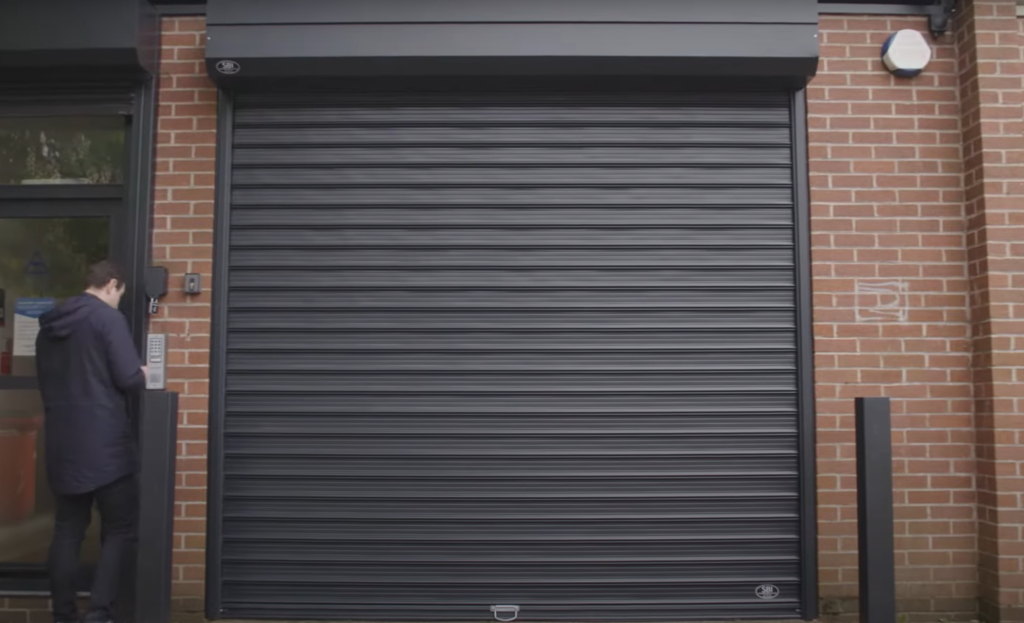 A professional performing commercial garage door repair in Baltimore, OH, highlighting high-quality and reliable service.