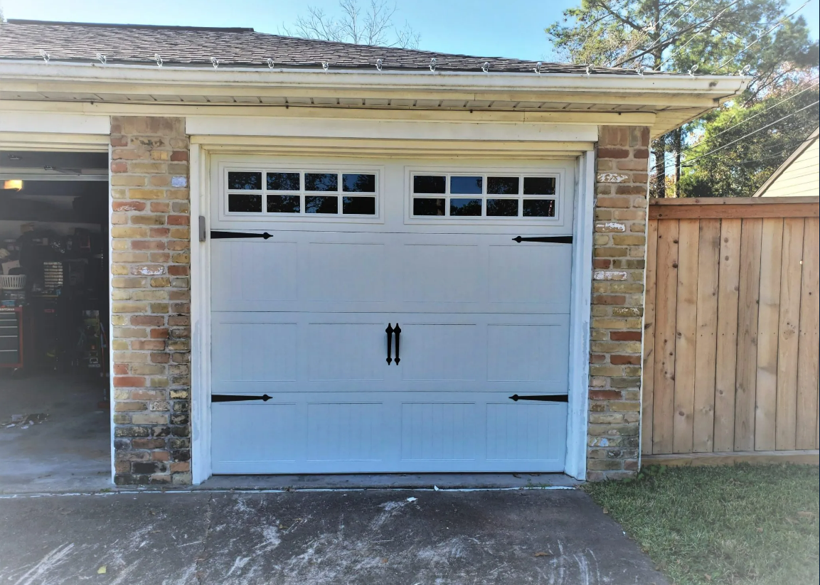 Custom garage door with unique patterns and colors, showcasing innovative remote access and smart home technology, constructed with durable, weather-resistant materials, featuring energy-efficient design and customizable hardware and window options.