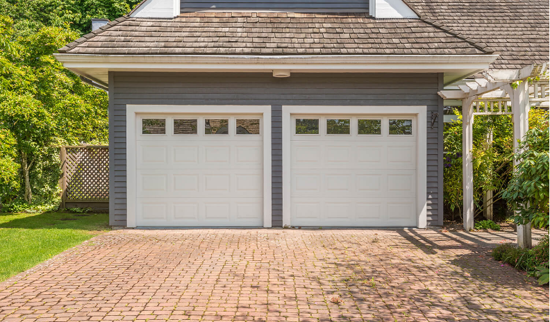 Local garage door repair technician servicing a garage door in Baltimore, OH