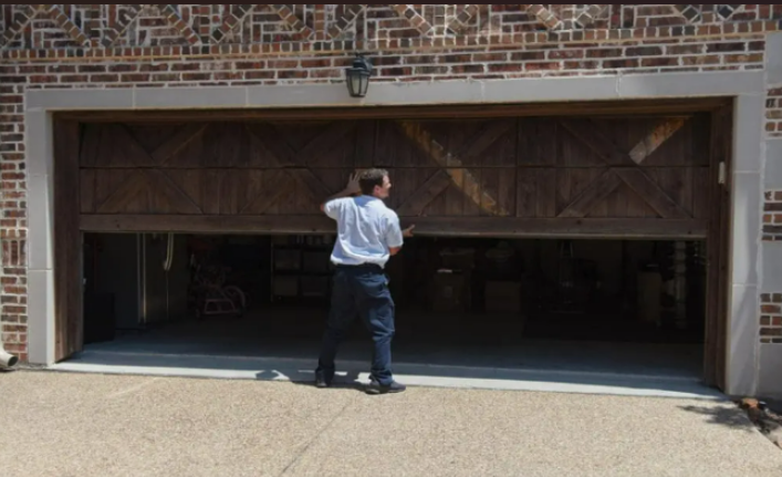 Local garage door repair team servicing a garage door in Baltimore, OH, highlighting expert local service.