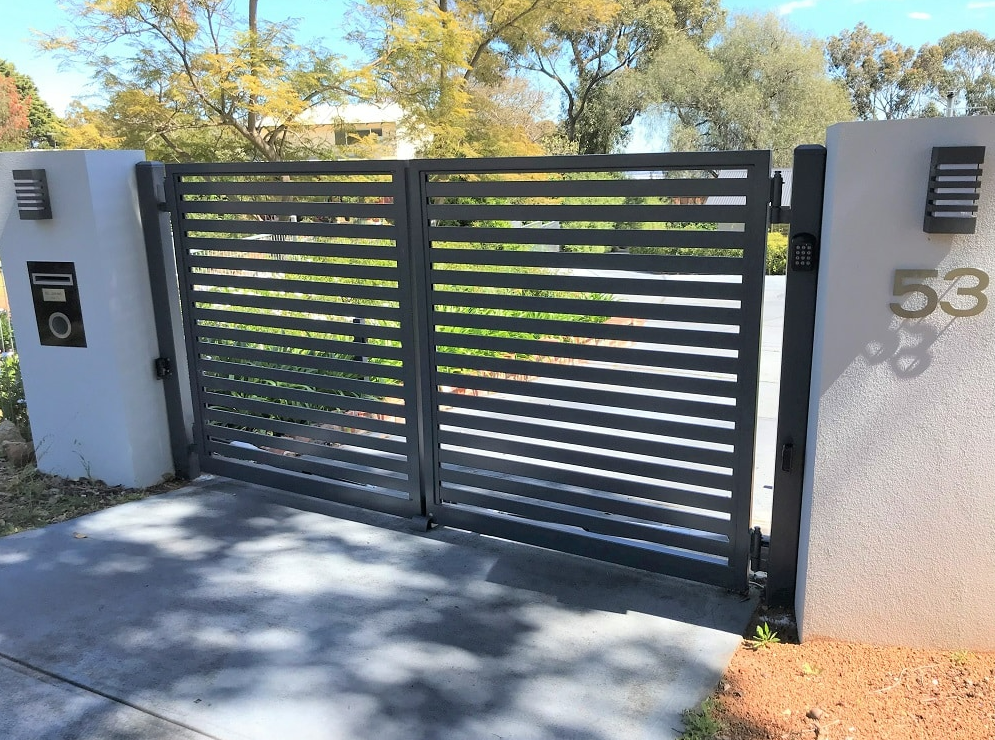 Technician performing precise residential gate repair in Baltimore, OH, showcasing quality service and smooth gate operation.