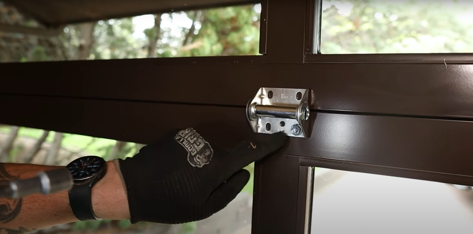 Professional technician performing garage door section replacement with high-quality materials in Baltimore, OH