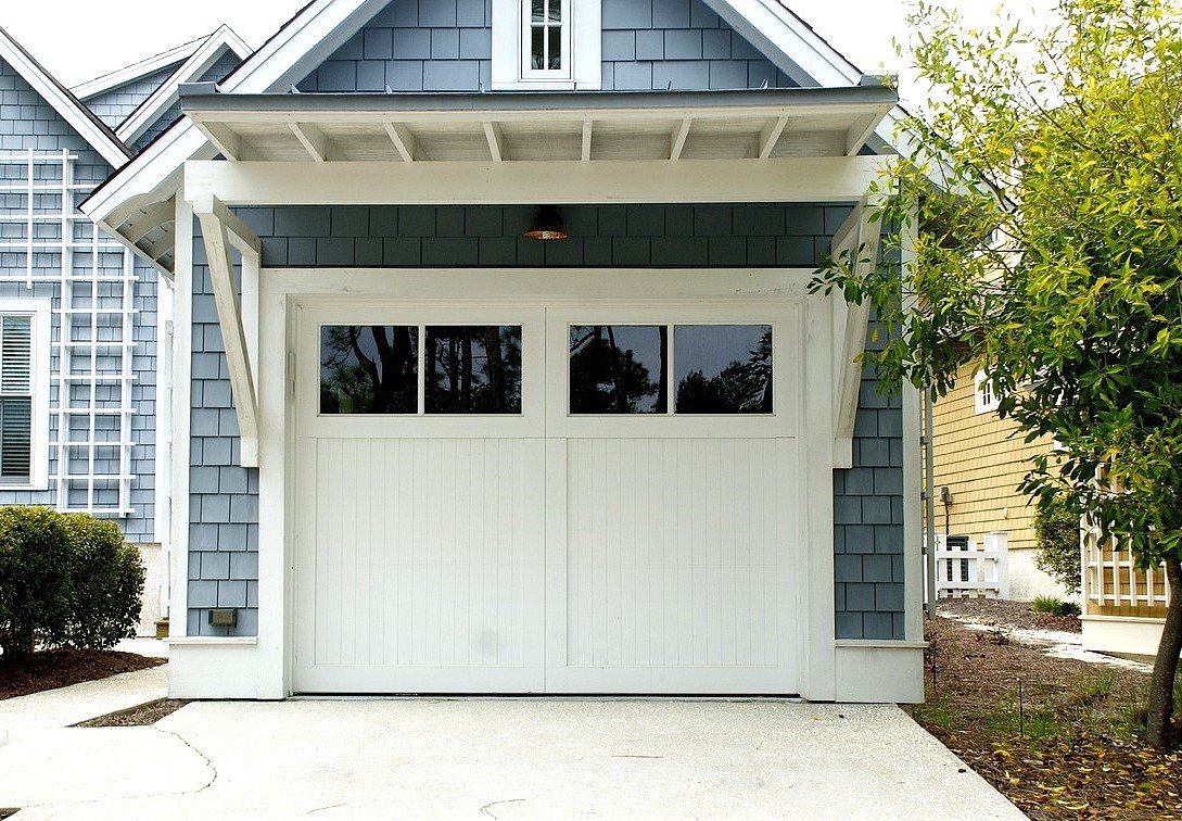 Professional team performing a garage door installation at a residential property in Baltimore, OH, using precision tools for secure and efficient setup.