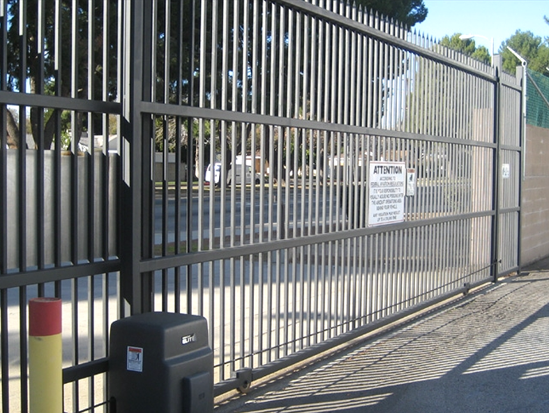 Professional technician repairing a commercial gate, showcasing expert service by Garage Door Repair in Baltimore, OH.