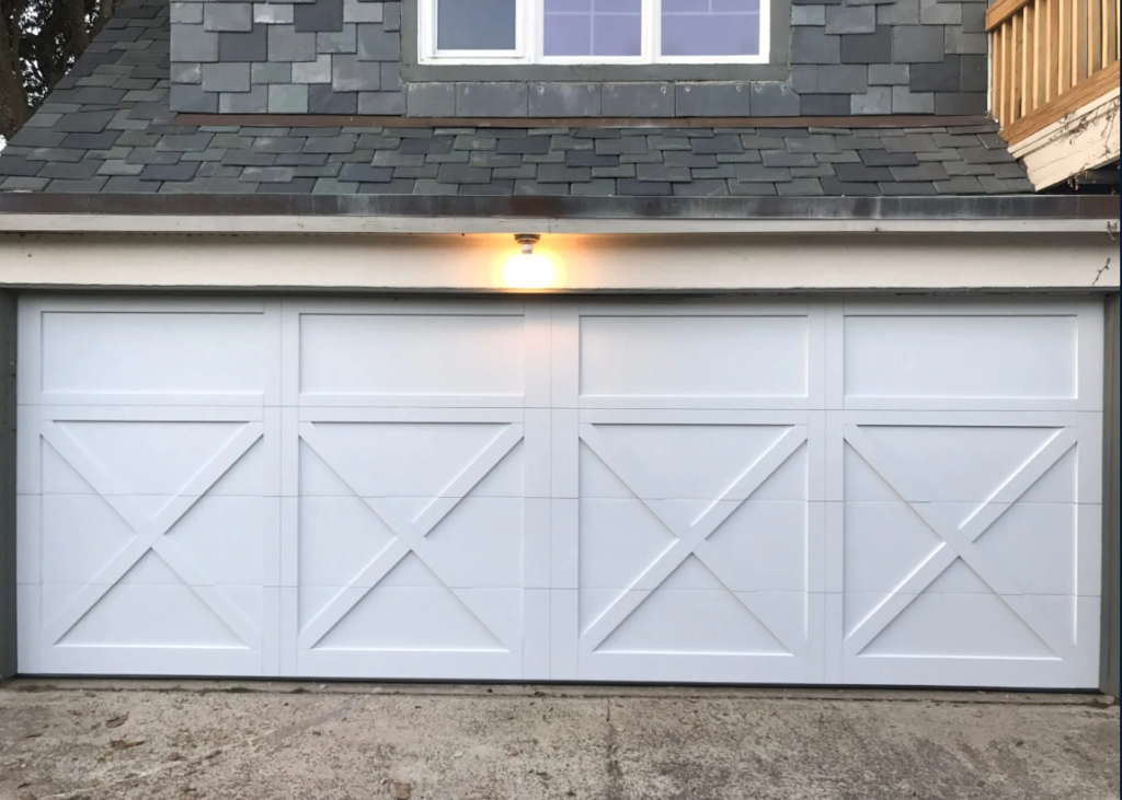 Newly installed modern garage door replacement in a Baltimore home, showcasing high-quality craftsmanship.